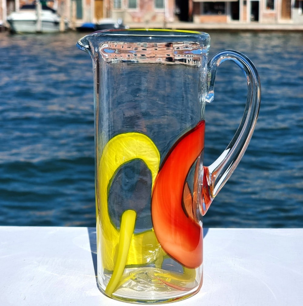 Chagall-Inspired Murano Glass Pitcher in Polychrome: Chagall-Inspired Murano Glass Pitcher in Polychrome A striking work of art glass, this handcrafted pitcher is created using traditional glassblowing techniques. Colored fragments—known as macete in