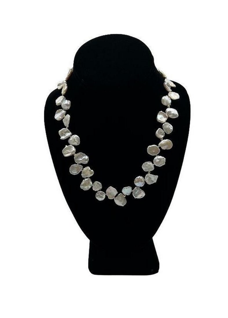 Luxurious Keshi Coin Pearl Necklace: Luxurious Keshi Coin Pearl Necklace Keshi pearls are individually pinned together to create a rope-like dangle of pearly iridescence. These pearls are known for their breathtaking luster, the beautif