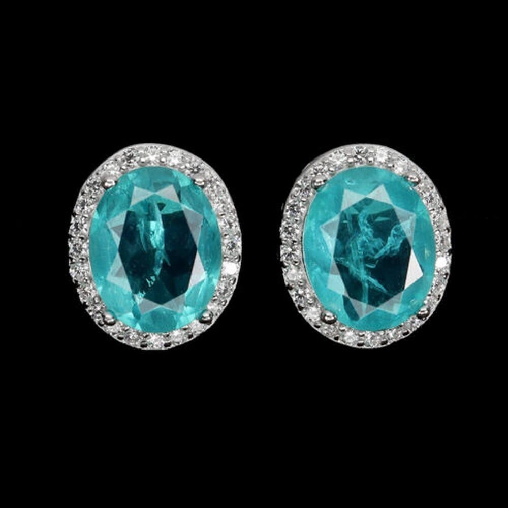 Sterling Silver & Synthetic Emerald Earrings: Sterling Silver & Synthetic Emerald Earrings These Sterling Silver & Synthetic Emerald Earrings feature vibrant, synthetic emerald stones set in elegant sterling silver settings. The rich