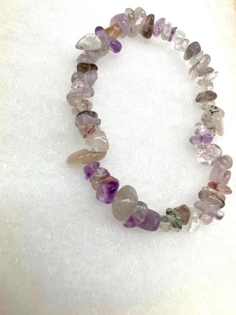 Handmade Mixed Purple Rutilated Quartz Chip Beaded Bracelet: Handmade Mixed Purple Rutilated Quartz Chip Beaded Bracelet This stunning bracelet features a beautiful blend of natural purple rutilated quartz chip beads, known for their striking needle-like inclu