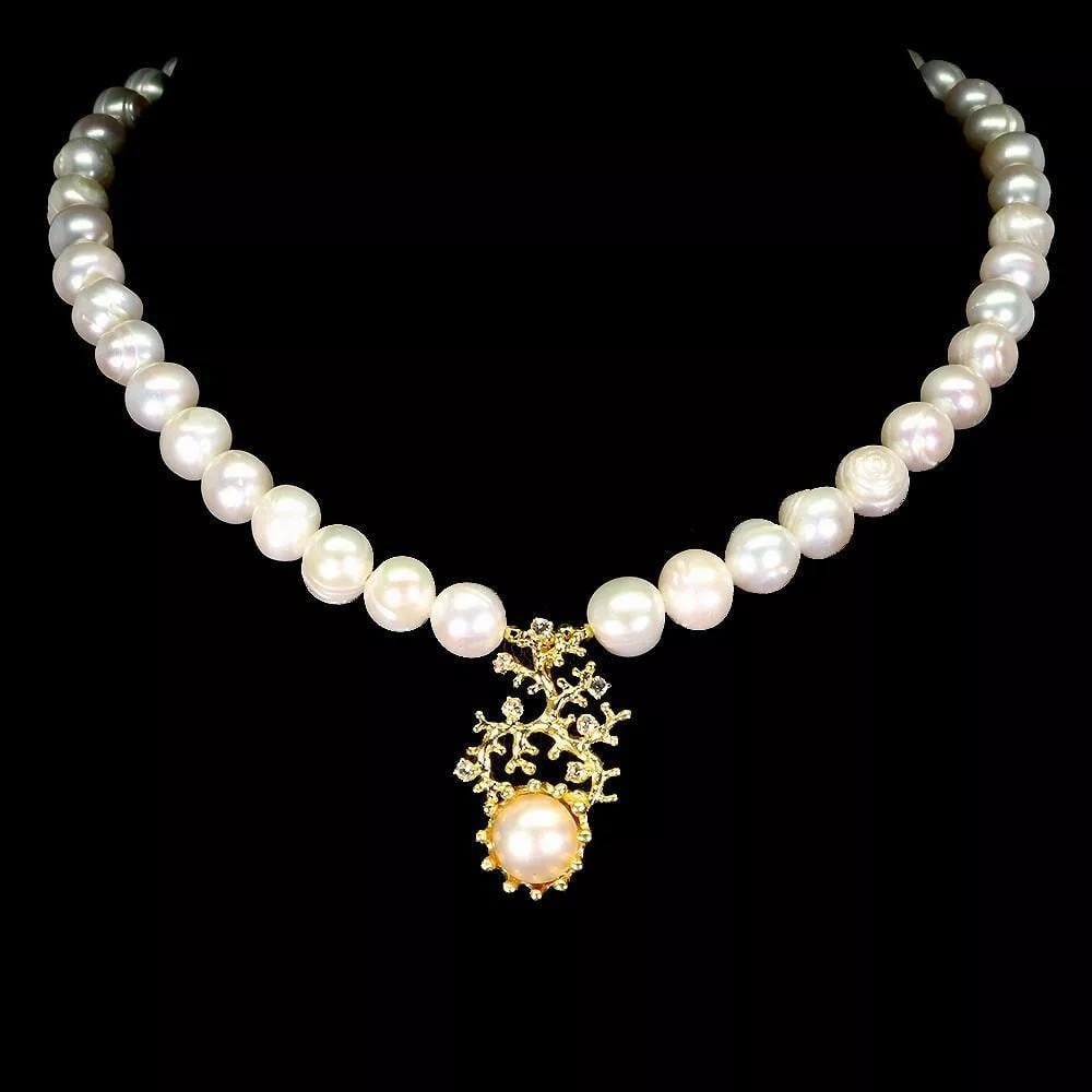 925 Sterling Silver Necklace with Topaz and Natural Pearl 17": 925 Sterling Silver Necklace with Topaz and Natural Pearl 17" This elegant 17" necklace features a natural pearl and sparkling topaz set in 925 sterling silver, blending classic beauty with a