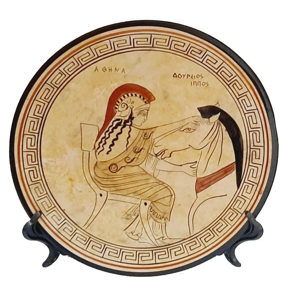 Greek White-Ground Ceramic Plate – Athena and the Trojan Horse Replica: Greek White-Ground Ceramic Plate – Athena and the Trojan Horse Replica This 20 cm Ancient Greek–inspired decorative ceramic plate is painted in the white-ground technique, a style developed in Att