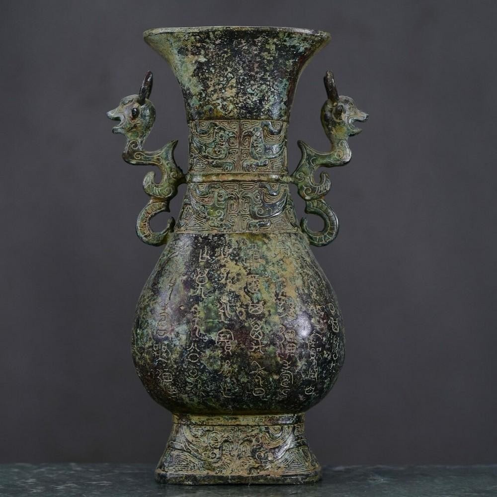 Antique Chinese Inscribed Square Bronze Bottle Ornament: Antique Chinese Inscribed Square Bronze Bottle Ornament This antique Chinese square bronze bottle ornament features finely inscribed details, reflecting exceptional craftsmanship and historical signi