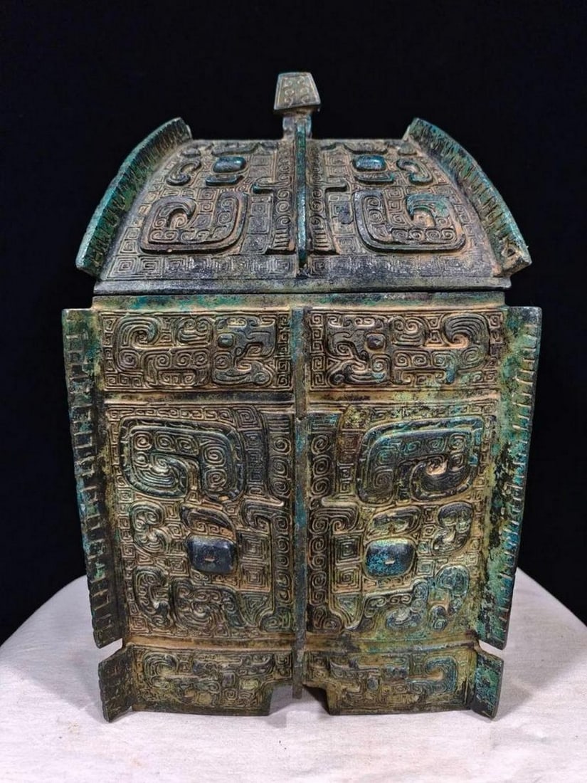 Antique Chinese Inscribed Fang Yi Bronze Whine Vessel: Antique Chinese Inscribed Fang Yi Bronze Whine Vessel This antique Chinese inscribed Fang Yi bronze wine vessel is a remarkable example of ancient craftsmanship. Adorned with intricate inscriptions,