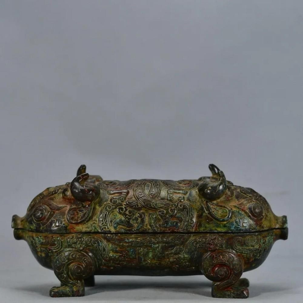 Antique Chinese Mythological Beast Bronze Ornament: Antique Chinese Mythological Beast Bronze Ornament This antique Chinese bronze ornament features a mythological beast, embodying strength, protection, and mysticism. The intricate detailing highlight