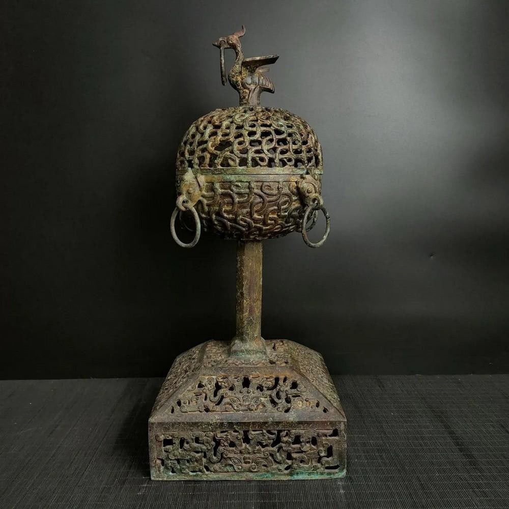 Antique Chinese Standing Bronze Incense Burner: Antique Chinese Standing Bronze Incense Burner This antique Chinese standing bronze incense burner is a masterful blend of form and function, with intricate detailing that highlights its traditional
