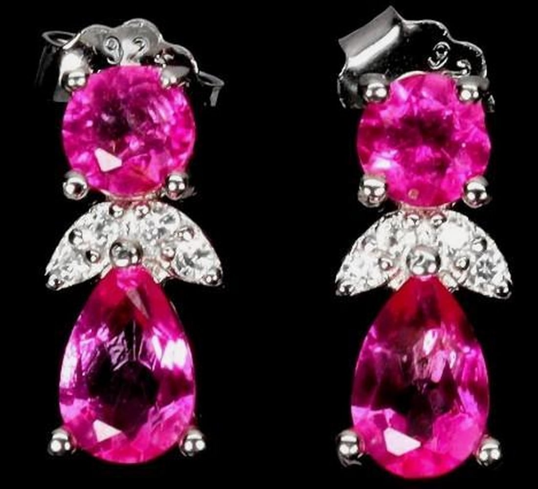 925 Sterling Silver Earrings with Pear Pink Topaz Gemstones: 925 Sterling Silver Earrings with Pear Pink Topaz Gemstones These elegant 925 sterling silver earrings showcase genuine pear-cut pink topaz gemstones measuring 6×4mm. The soft blush tones of the