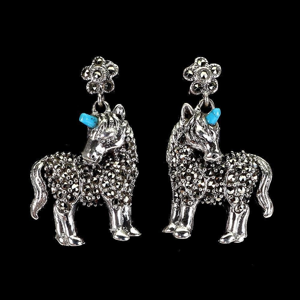Stabilized Fancy Turquoise Marcasite Unicorn Earrings: Stabilized Fancy Turquoise Marcasite Unicorn Earrings This unique pair of earrings features a 925 sterling silver unicorn with a top rich blue fancy cabochon horn. This pair of earrings is a