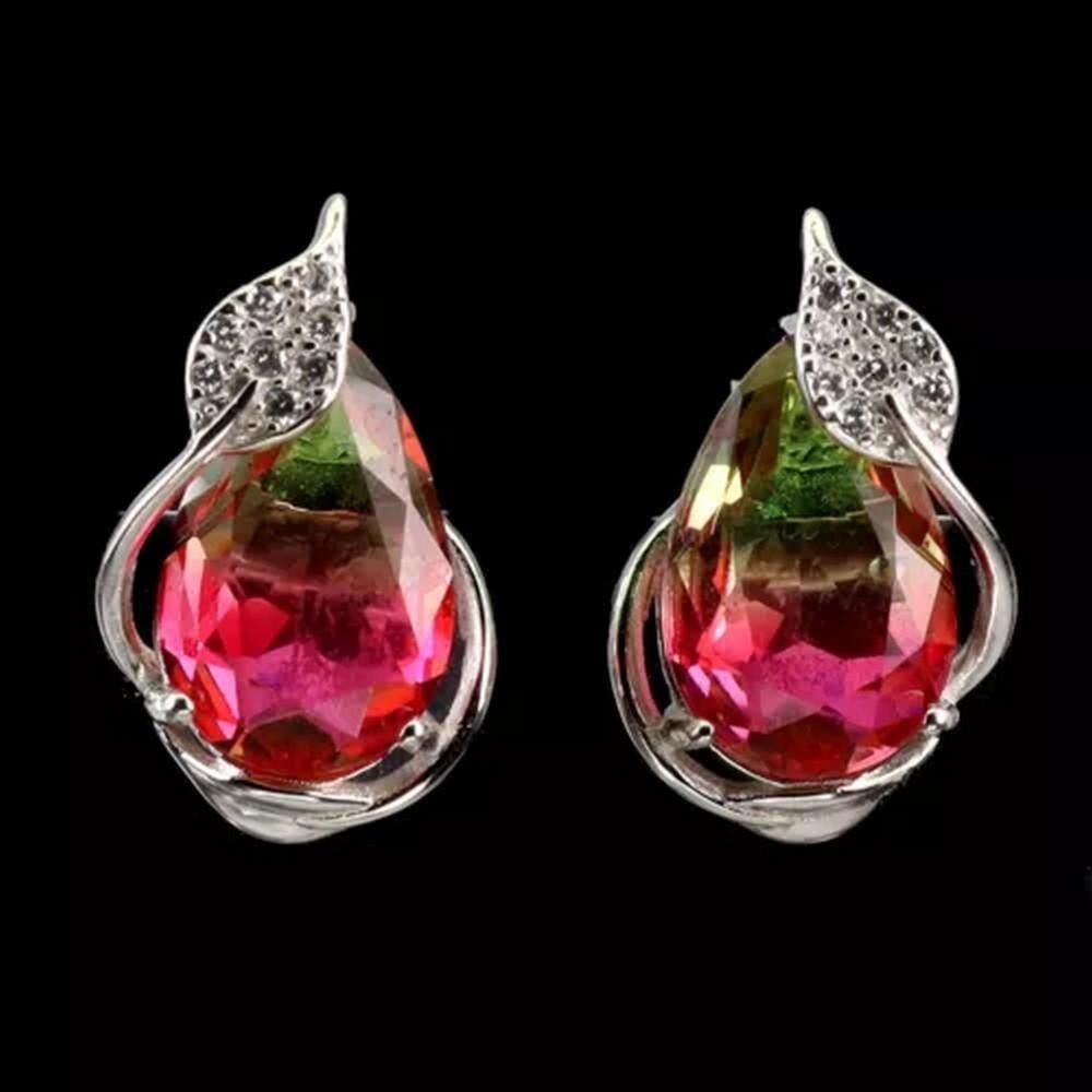 Sterling Silver & Synthetic Pink/Green Tourmaline Earrings: Sterling Silver & Synthetic Pink/Green Tourmaline Earrings These sterling silver earrings feature vibrant synthetic pink and green tourmaline stones, creating a striking contrast of colors. The d