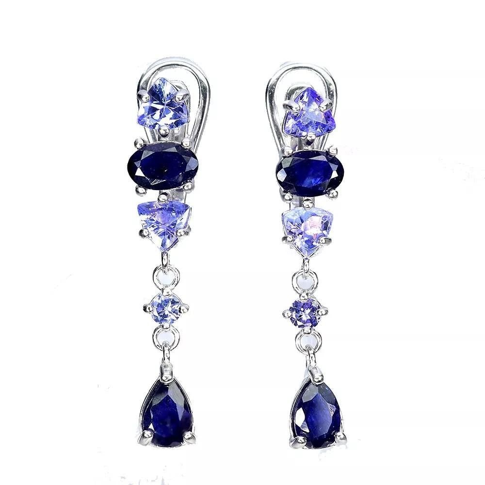 Heated Pear Blue Sapphire and Tanzanite Earrings in 925 Sterling Silver: Heated Pear Blue Sapphire and Tanzanite Earrings in 925 Sterling Silver These exquisite earrings feature heated pear-shaped blue sapphire gemstones, complemented by sparkling tanzanites, all set in 92