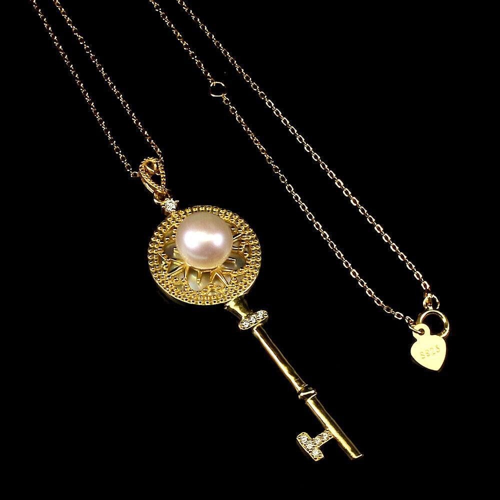 18" Round 8mm White Pearl and CZ 925 Sterling Silver Key Necklace: 18" Round 8mm White Pearl and CZ 925 Sterling Silver Key Necklace Introducing our elegant 18" Round 8mm White Pearl and CZ Sterling Silver Key Necklace, a symbol of sophistication and grace. C