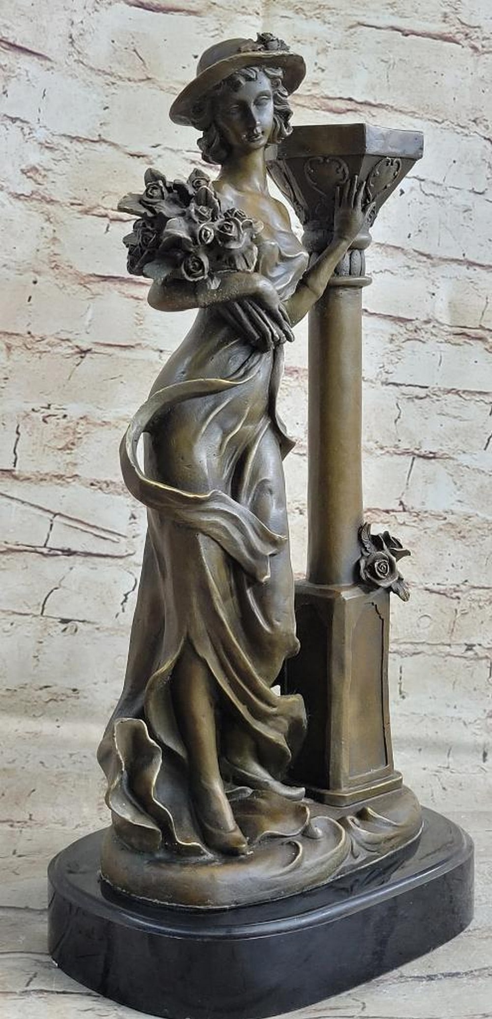 J. Kassin’s Original Bronze Sculpture of a Female Figure with Flowers – 16" x 8": J. Kassin’s Original Bronze Sculpture of a Female Figure with Flowers – 16" x 8" This exquisite bronze sculpture depicts a graceful female figure standing beside a pillar, delicately holdi