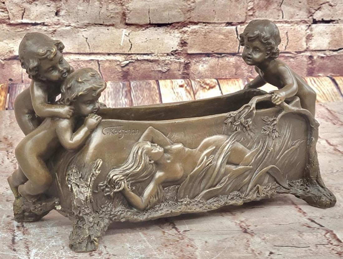 C. Korschann’s Reproduction Bronze Sculpture of Three Boys and a Woman – 6.5" x 12": C. Korschann’s Reproduction Bronze Sculpture of Three Boys and a Woman – 6.5" x 12" This playful bronze sculpture depicts three young boys peering over a candy dish at a reclining nude wo