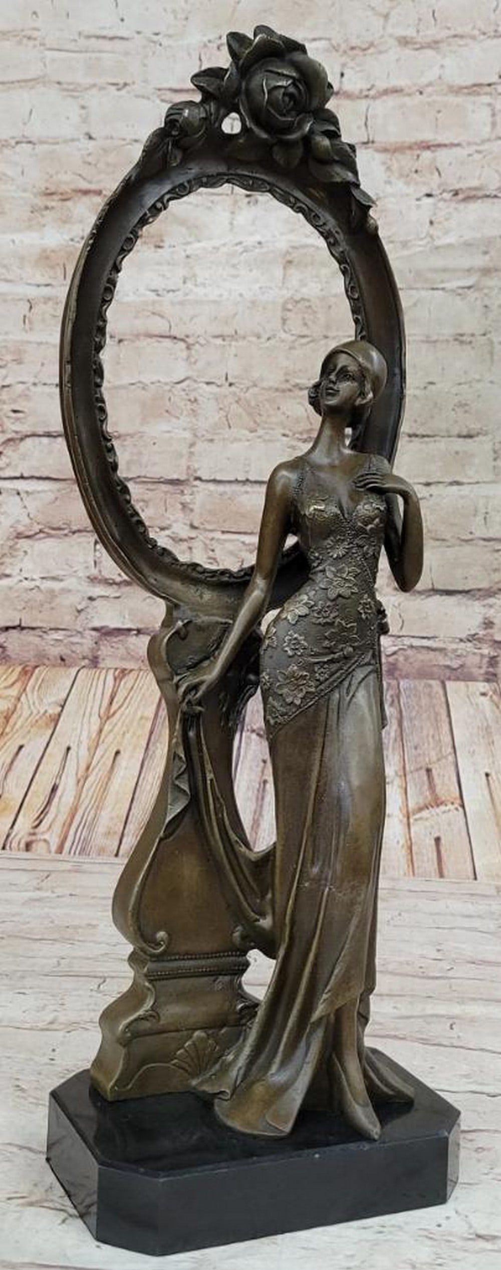 Graceful Bronze Picture Frame Sculpture by Milo - 18.5" x 6": Graceful Bronze Picture Frame Sculpture by Milo - 18.5" x 6" This elegant bronze sculpture by Milo, inspired by 1940s design, features a graceful woman in a timeless pose, blending art and fu