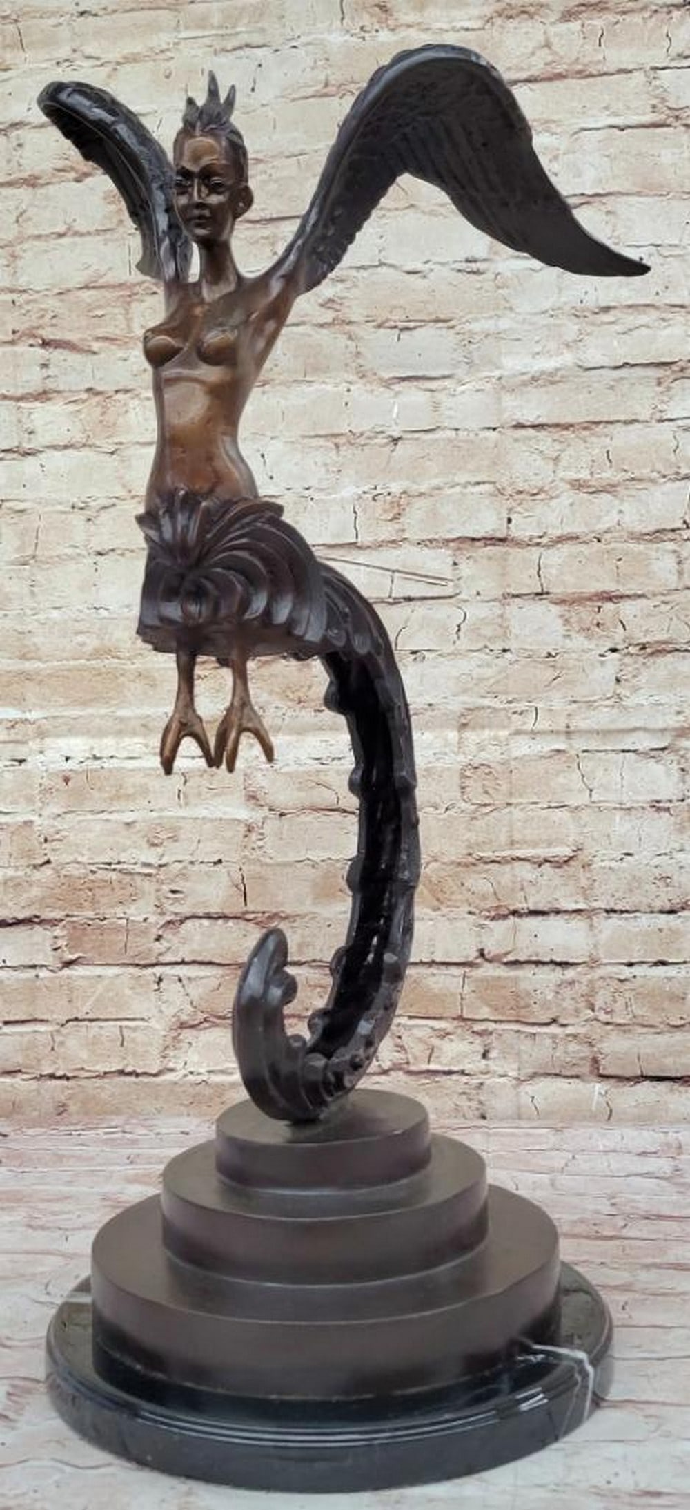 Kinnara Woman Bronze Sculpture by Marius – 24" x 13": Kinnara Woman Bronze Sculpture by Marius – 24" x 13" This limited edition bronze sculpture by Marius depicts the mystical Kinnaree, a revered figure in Thai literature celebrated for her hal