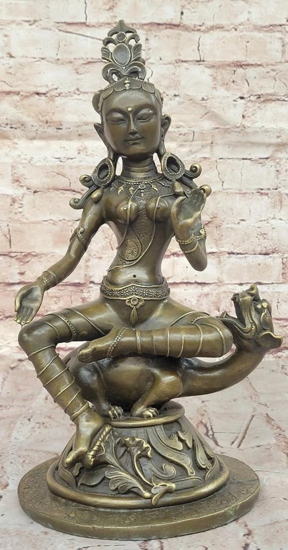 Original Bronze Guanyin Statue by B.C. Zhang - 14" x 7": Original Bronze Guanyin Statue by B.C. Zhang - 14" x 7" This exquisite bronze statue of Guanyin, signed by artist B.C. Zhang, embodies the serene grace and spiritual depth of the revered Godd