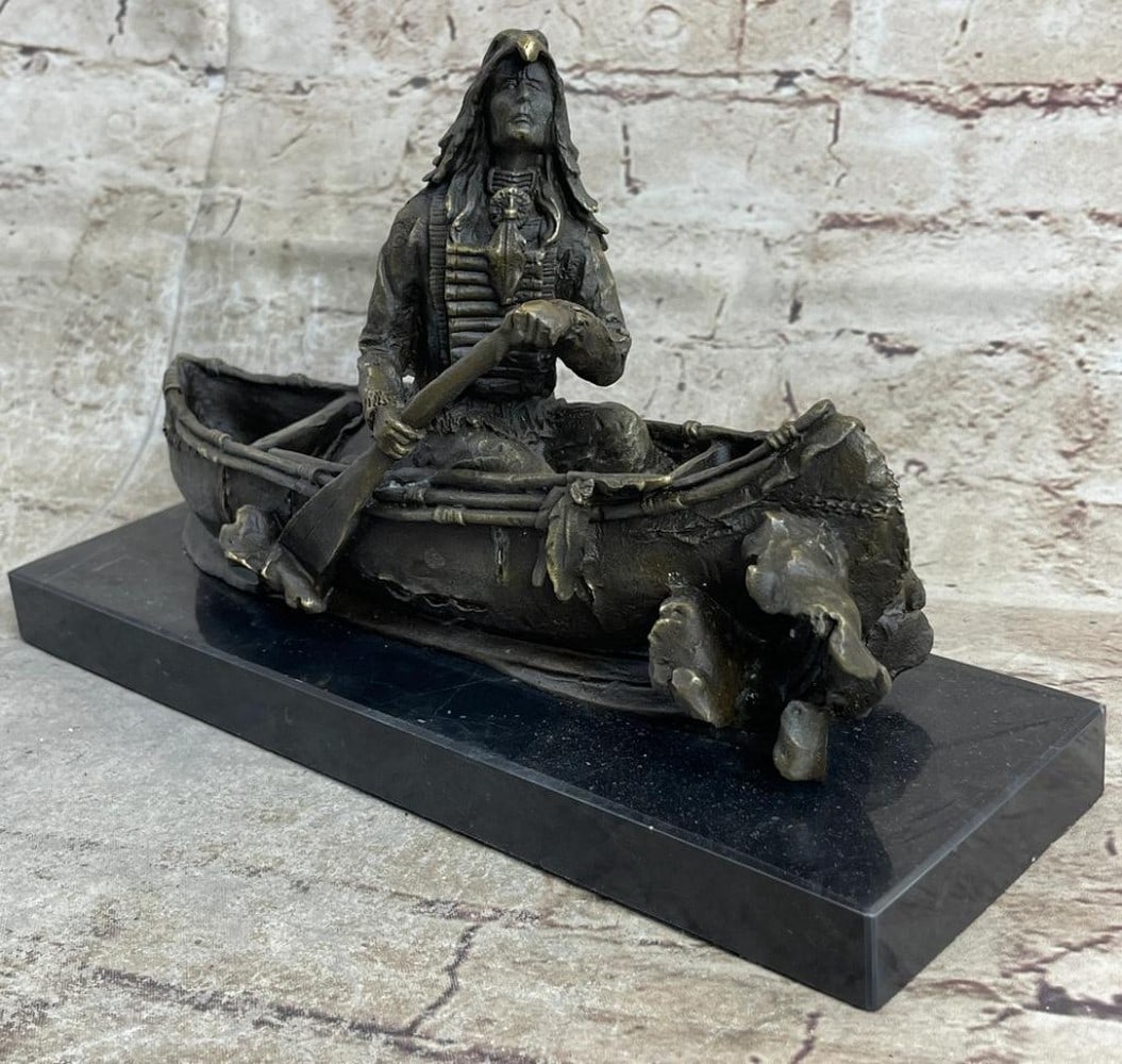 Native American Indian Man in Canoe Original Bronze Statue - 7" x 10": Native American Indian Man in Canoe Original Bronze Statue - 7" x 10" This bronze sculpture portrays a Native American Chief paddling a birchbark canoe, symbolizing bravery and leadership on