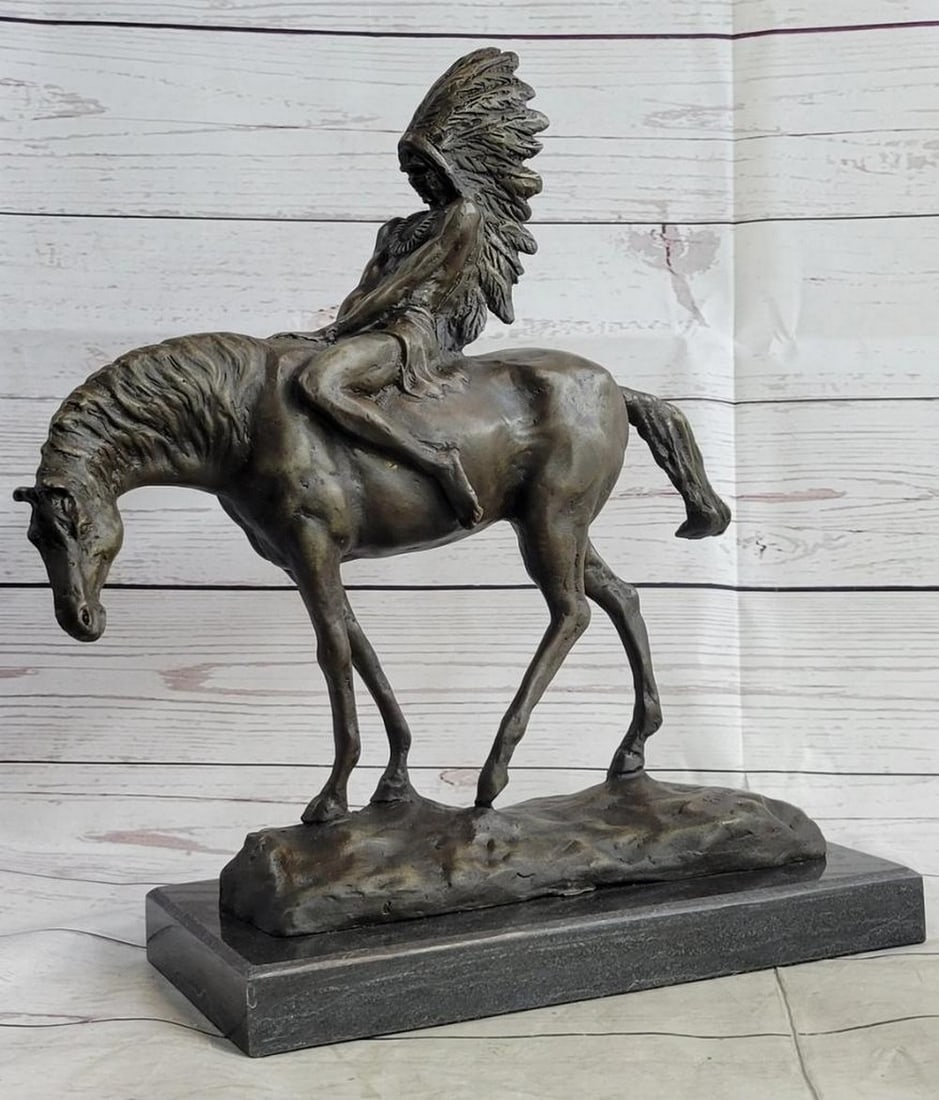 Native American Man on Horseback Original Bronze Statue - 14" x 12": Native American Man on Horseback Original Bronze Statue - 14" x 12" This bronze sculpture depicts a young Native American chief riding proudly through the wilderness, adorned with a feathere