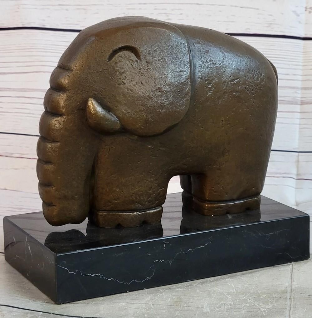 Abstract Elephant Modern Art Inspired Bronze - 6.5" x 7": Abstract Elephant Modern Art Inspired Bronze - 6.5" x 7" This modern art piece captures the essence of an elephant through abstract bronze forms. Its smooth, flowing lines and simplified sha