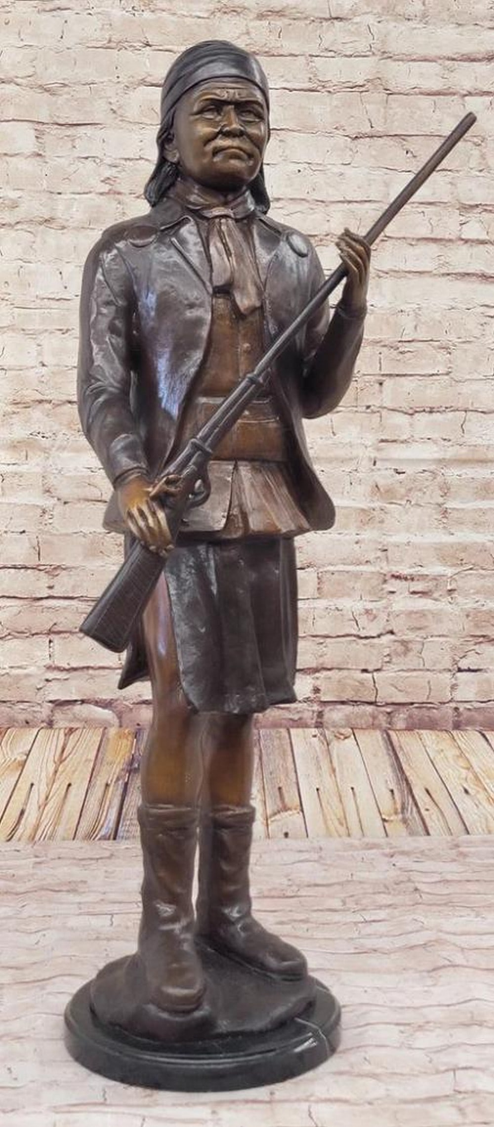 Military Leader Geronimo Wielding Rifle Inspired Bronze Statue - 31" x 19.5": Military Leader Geronimo Wielding Rifle - 31" x 19.5" This bronze epitomizes the iconic Native American leader in a commanding stance. Meticulously crafted using the lost wax method, the ar