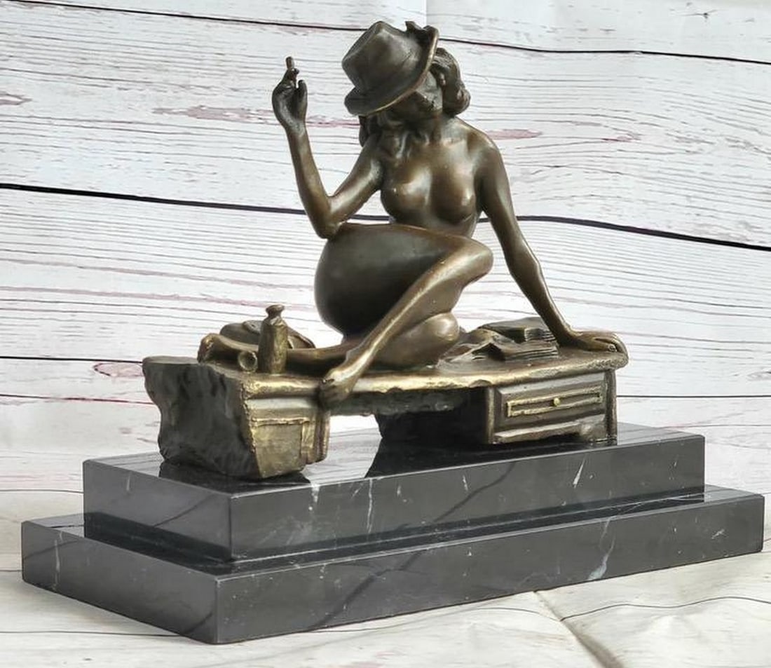 Handmade Classic Flapper Jazz Woman Bronze Sculpture - 8" x 9": Handmade Classic Flapper Jazz Woman Bronze Sculpture - 8" x 9" With style, grace and ease she leans back while she is laying seductively on a bench, wearing her lover`s hat and holding a