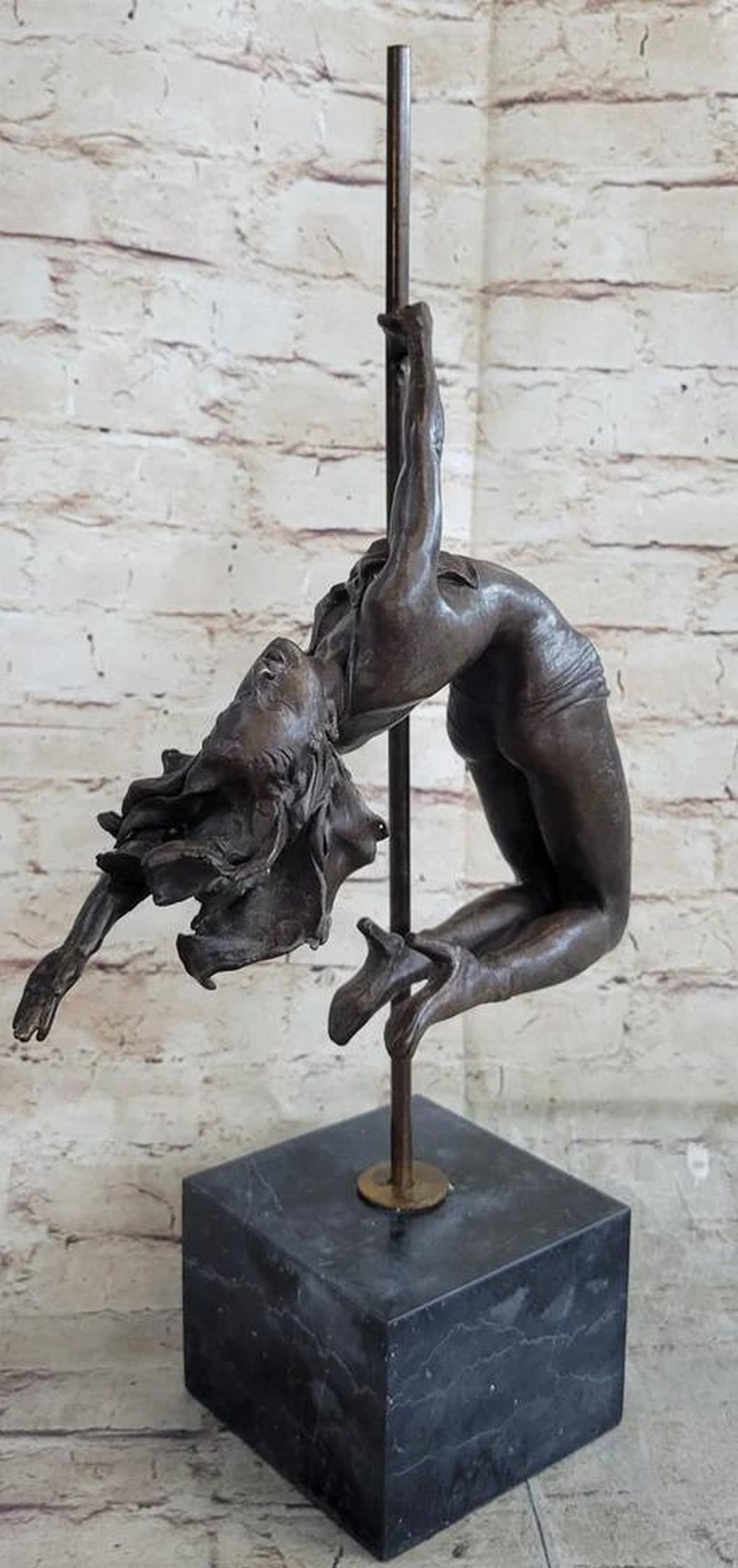 Dynamic Female Pole Dancer Bronze Contemporary Art Sculpture - 19" x 10": Dynamic Female Pole Dancer Bronze Contemporary Art Sculpture - 19" x 10" Experience the captivating allure of the "Dynamic Female Pole Dancer" Bronze Contemporary Art Sculpture, meticu