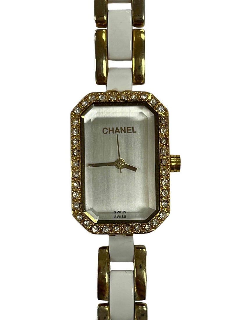 Inspired by Chanel White and Gold Ladies Watch: Inspired by Chanel White and Gold Ladies Watch A classy looking watch featuring a double wrap link band. Austrian crystal around the face of the watch and white enamel on the band. View photos for