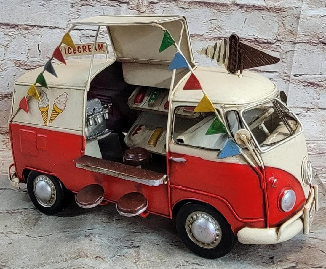 Die Cast Vintage Decorative VW Van: Die Cast Vintage Decorative VW Van Add sporty charm to any space with our Rustic 1966 Volkswagen US Ice Cream Truck Sculpture. Featuring a rustic iron frame and a detailed red-and-white exterior,