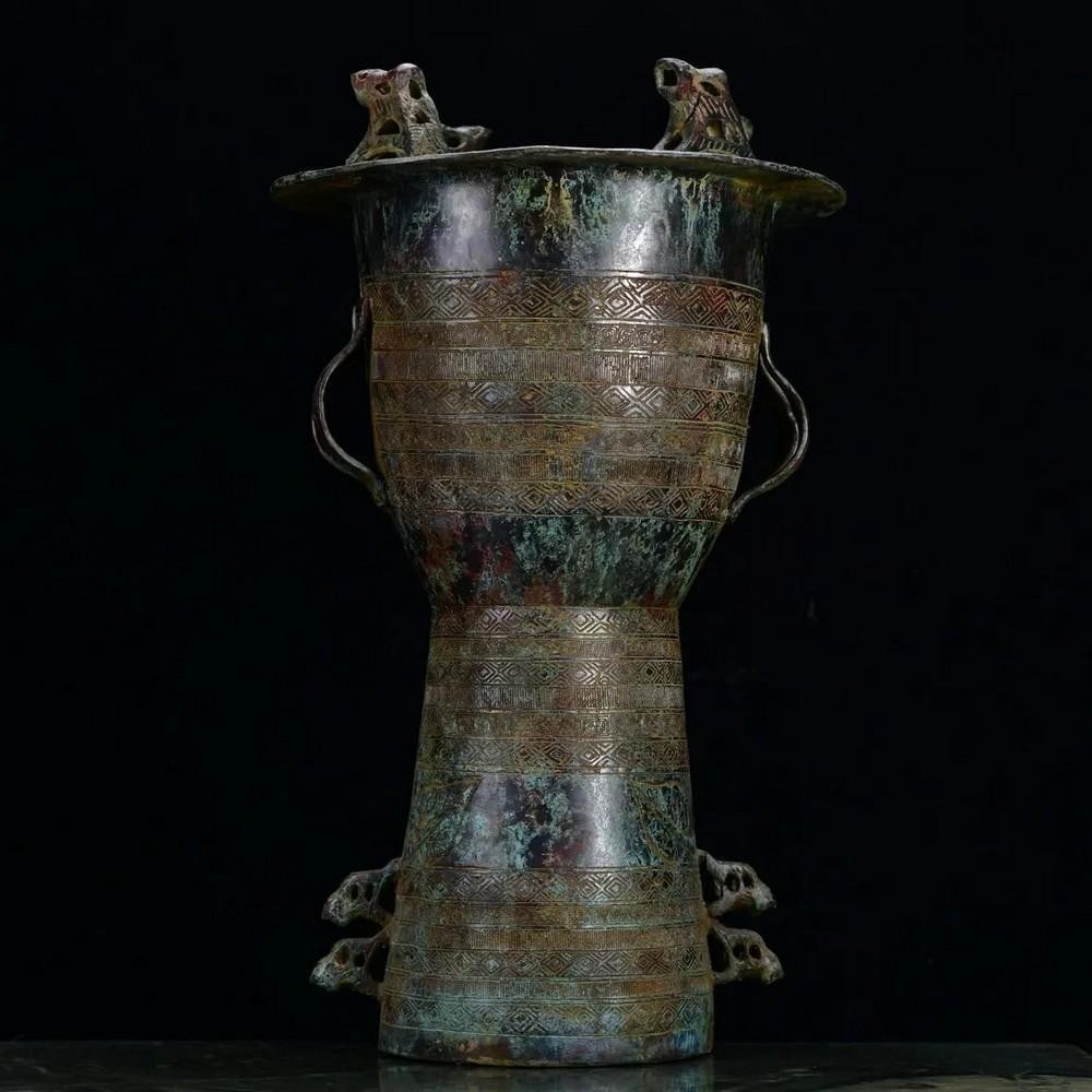 Antique Chinese Bronze Sun God Drum Ornament: Antique Chinese Bronze Sun God Drum Ornament This rare handcrafted bronze drum ornament is adorned with intricate sun god motifs, symbolizing vitality and divine power in ancient Chinese culture. Exqu