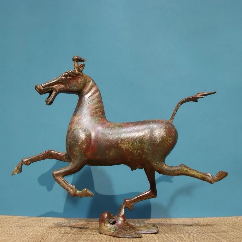 Antique Chinese Bronze Statue of Horse Stepping on Flying Swallow: Antique Chinese Bronze Statue of Horse Stepping on Flying Swallow This antique bronze statue captures the dynamic grace of a horse stepping on a flying swallow, symbolizing power, speed, and victory