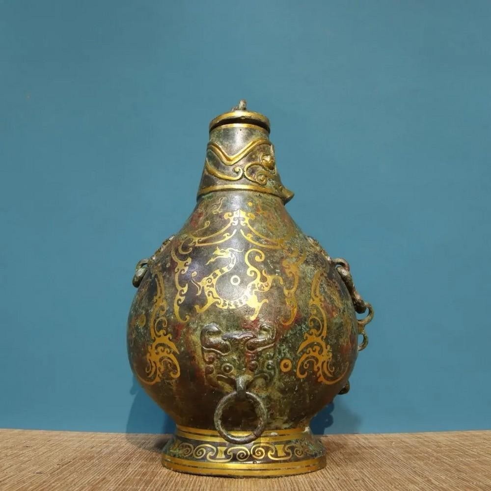 Antique Chinese Inlaid Inscribed Bronze Pot Ornament: Antique Chinese Inlaid Inscribed Bronze Pot Ornament This antique bronze pot ornament features delicate inlays and detailed inscriptions, showcasing the artistry and cultural significance of