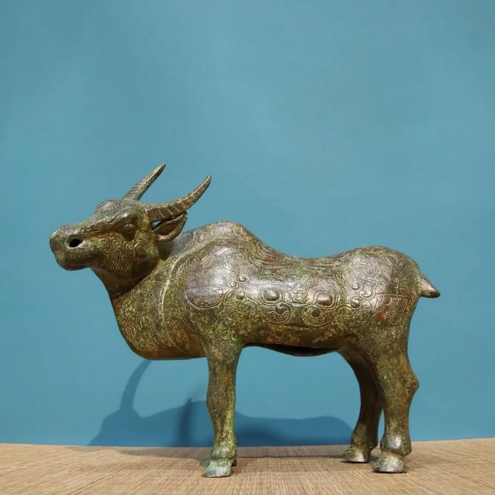 Chinese Handmade Bronze Full-Work Ox Statue: Chinese Handmade Bronze Full-Work Ox Statue This rare and exquisitely handcrafted bronze full-work ox statue is a remarkable representation of traditional Chinese artistry. The ox, symbolizing