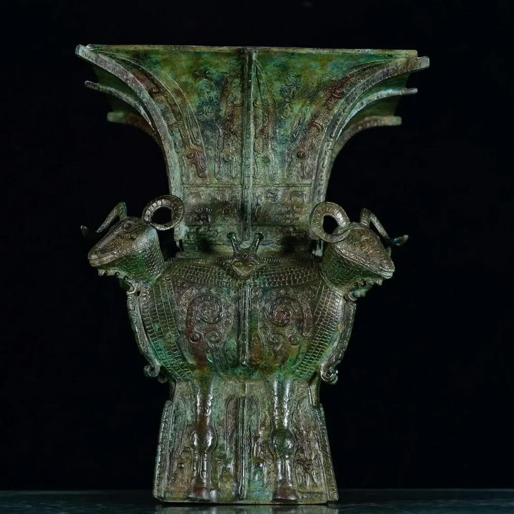 Antique Chinese Bronze Four-Ram Square Statue Ornament: Antique Chinese Bronze Four-Ram Square Statue Ornament This rare handcrafted bronze statue features a square base adorned with four intricately detailed rams, symbolizing prosperity, harmony, and stre