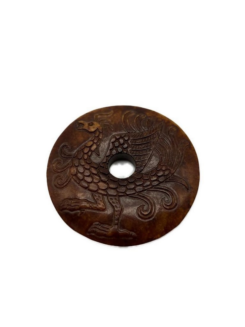 Hand Carved Jade Hongshan Culture Phoenix Medallion: Hand Carved Jade Hongshan Culture Phoenix Medallion A exquisite and culturally rich piece of art that showcases the skilled craftsmanship and historical significance of the Hongshan culture.