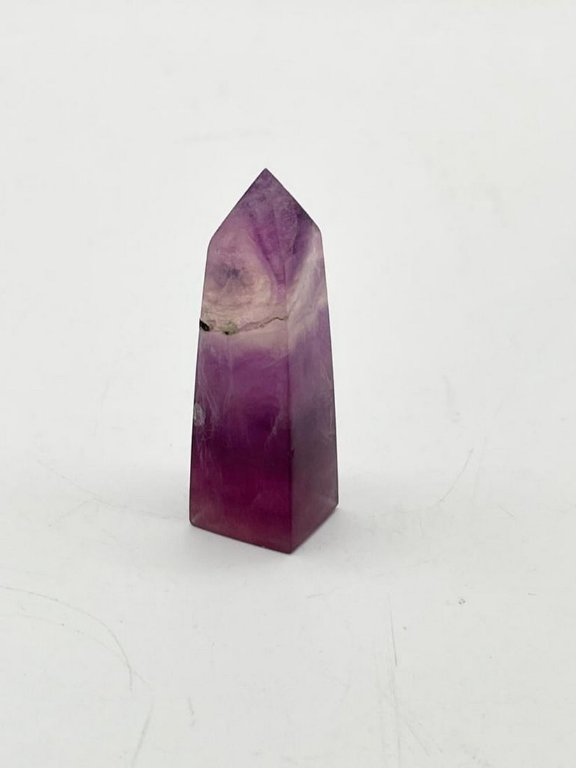Rainbow Tower Fluorite Crystal 1PC: Rainbow Tower Fluorite Crystal 1PC This gemstone is known to instill confidence, relaxation, and compassion. Refocus tough situations with this tower as it brings a calming and stable energy and help