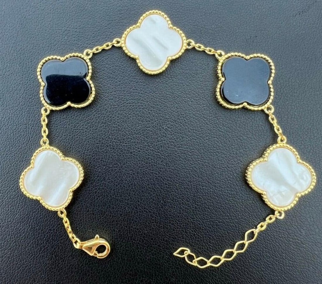 14k Gold Vermeil 925 White Pearl Black Onyx Flower Bracelet: 14k Gold Vermeil 925 White Pearl Black Onyx Flower Bracelet This bracelet features alternate black onyx & mother of pearl motifs. Dimensions: 6-7.7"L View Photos For Further Details
