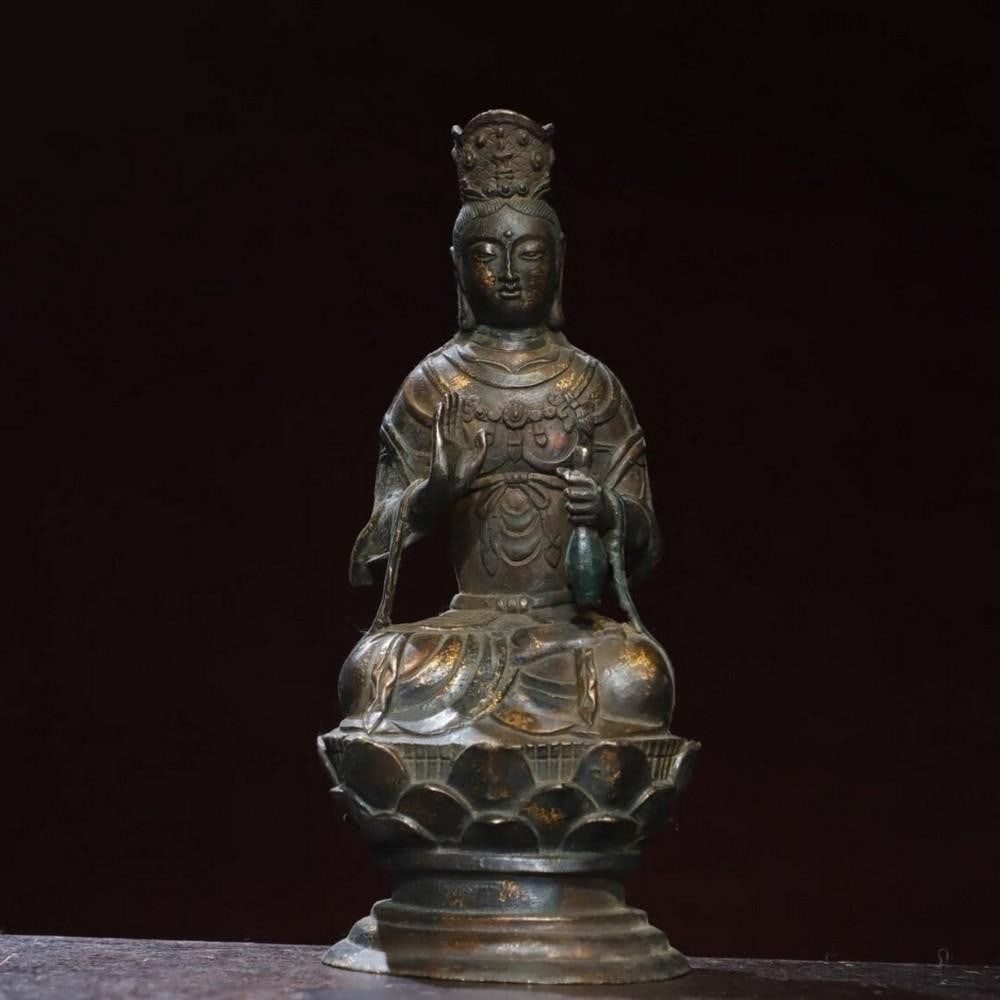 Handcrafted Gilded Copper Guanyin Buddha Statue: Handcrafted Gilded Copper Guanyin Buddha Statue This antique Guanyin Buddha statue is a testament to traditional Chinese craftsmanship, expertly handcrafted from pure copper and adorned with a rich g