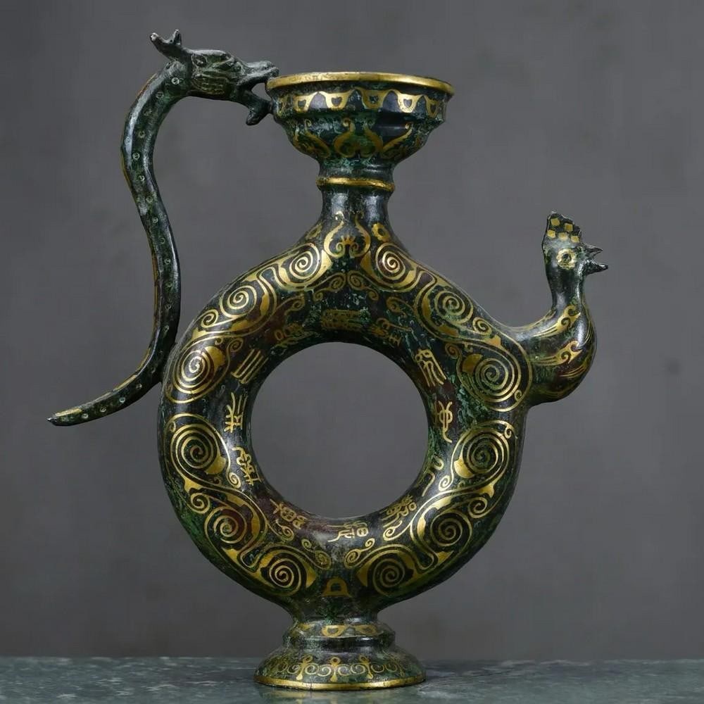 Chinese Bronze Inlaid Gold Dragon Handle Chicken Head Pot: Chinese Bronze Inlaid Gold Dragon Handle Chicken Head Pot This rare hand-crafted pot showcases traditional Chinese artistry, featuring a striking dragon handle and a finely sculpted chicken head spou