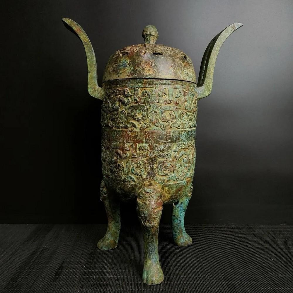 Antique Chinese Bronze Tripod Statue Ornament: Antique Chinese Bronze Tripod Statue Ornament This rare handcrafted bronze statue features a traditional tripod design, symbolizing strength, stability, and ancient ceremonial practices. The intricat