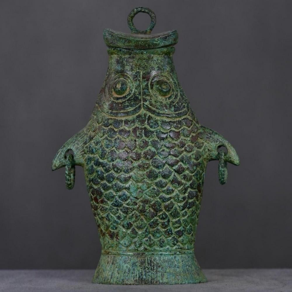 Antique Chinese Bronze Koi Statue: Antique Chinese Bronze Koi Statue This antique Chinese bronze statue captures the grace and symbolism of the koi fish, a revered emblem of perseverance, strength, and good fortune in Chinese culture