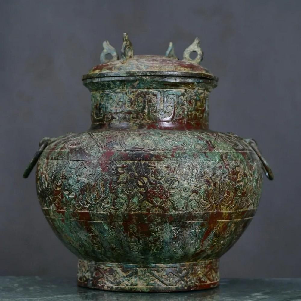Antique Chinese Four Ring Bronze Alter Pot: Antique Chinese Four Ring Bronze Alter Pot This antique Chinese four-ring bronze altar pot is a captivating example of traditional craftsmanship. Featuring four elegantly designed rings on its