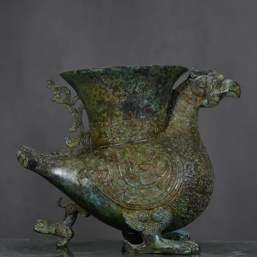 Antique Chinese Mythological Bird Bronze Statue: Antique Chinese Mythological Bird Bronze Statue Crafted with timeless elegance, this antique bronze statue captures the majestic essence of a Chinese mythological bird. Intricate detailing