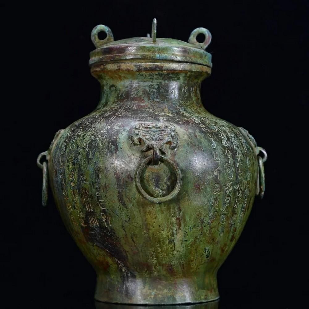 Antique Chinese 4 Ringed Bronze Alter Ornament: Antique Chinese 4 Ringed Bronze Alter Ornament This antique bronze altar ornament features a captivating design with four intricately crafted rings, symbolizing harmony and continuity in