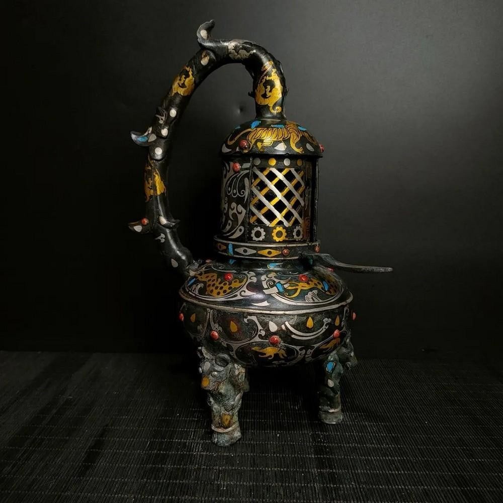 Antique Chinese Inlaid Turquoise Bronze Lamp Ornament: Antique Chinese Inlaid Turquoise Bronze Lamp Ornament This antique Chinese bronze lamp ornament is beautifully inlaid with turquoise, creating a striking contrast against the warm patina of the
