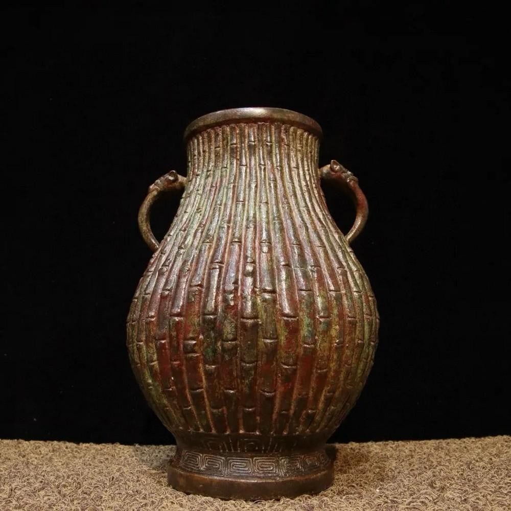 Antique Chinese Bronze Jar with Bamboo Shoot Design: Antique Chinese Bronze Jar with Bamboo Shoot Design This antique Chinese bronze jar features an elegant bamboo shoot design, symbolizing resilience and longevity in Chinese culture. The finely crafte