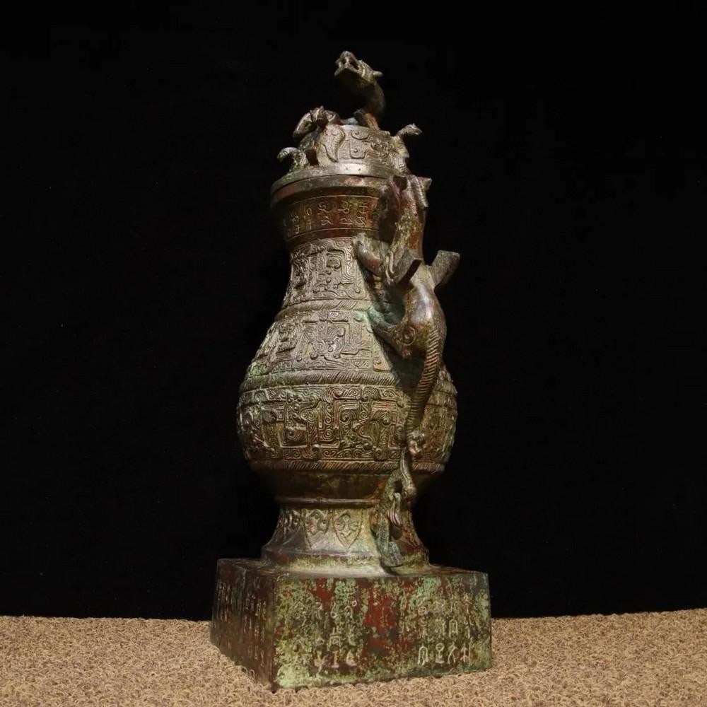 Antique Chinese Bronze Jar Ornament with Dragon Design: Antique Chinese Bronze Jar Ornament with Dragon Design This antique Chinese bronze jar ornament is adorned with an intricate dragon design, symbolizing power, strength, and good fortune in Chinese cu