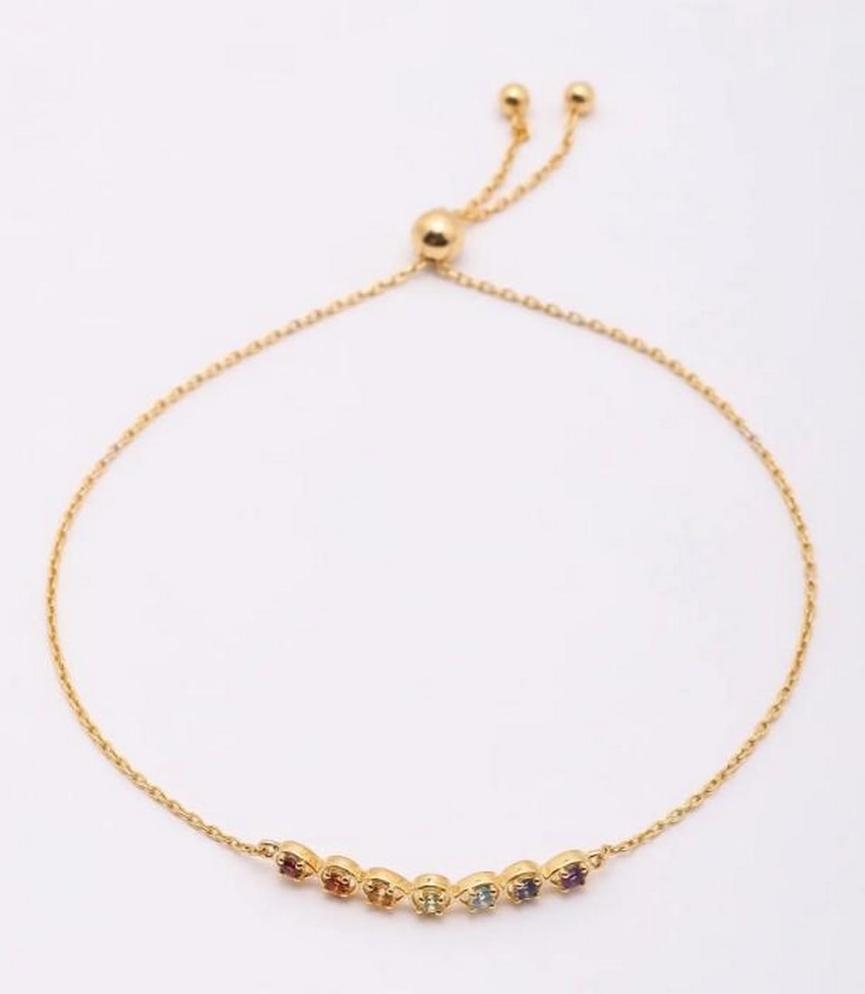 Rainbow Orbit Gemstone Bracelet: Rainbow Orbit Gemstone Bracelet A celebration of color and brilliance, this wraparound bracelet features an array of semi-precious gemstones, each carefully faceted to enhance its natural beauty. De