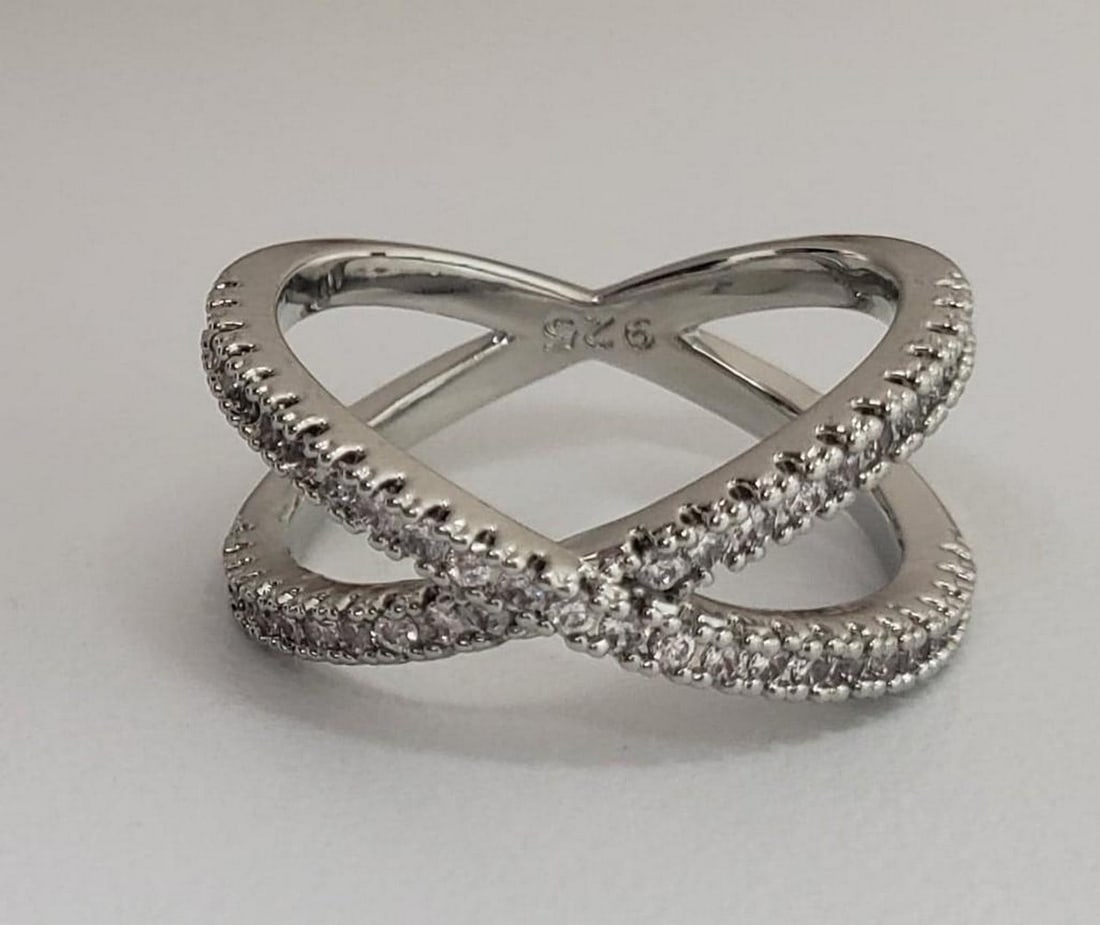 Sterling Silver 925 CZ Rhinestone Crossband Ring: Sterling Silver 925 CZ Rhinestone Crossband Ring. Ladies Size 7. Please View Photos For Further Details.