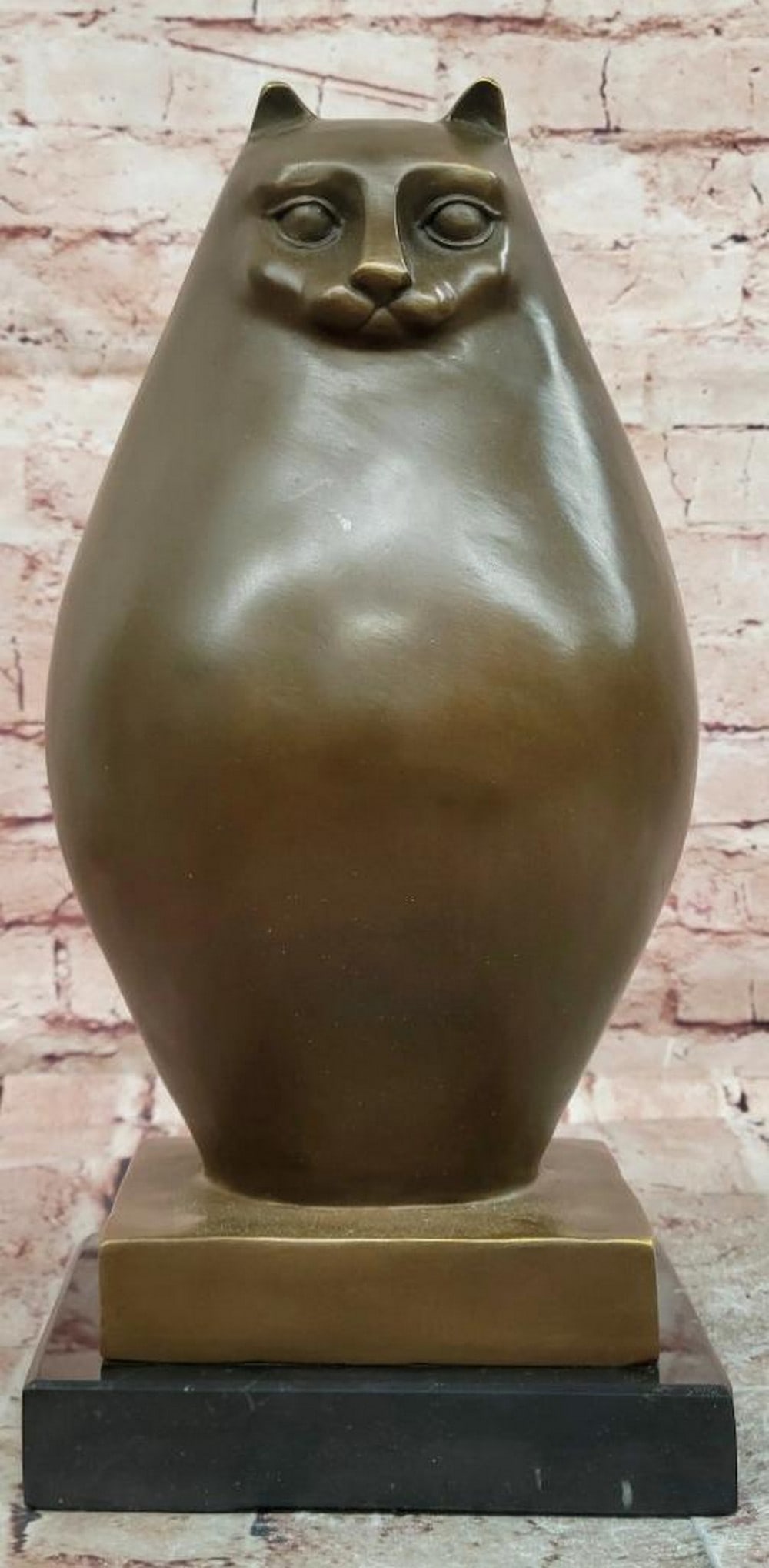 Botero Style Chubby Cat Bronze Sculpture - 13.5" x 6.5": Botero Style Chubby Cat Bronze Sculpture - 13.5" x 6.5" This bronze sculpture features a stylized cat with exaggerated rounded proportions and a smooth, simplified form. The design emphasizes