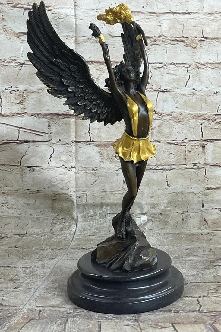 Angel Holding Torch Bronze Sculpture On Marble Base - 9lbs: An angel stands boldly. She hails from from the heavens and fights for the salvation of our world as well as his from darkness of any form. She wears a robe and sandals, carrying a torch with her wing